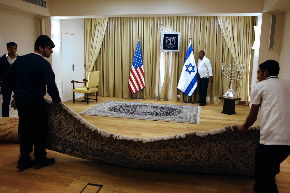 Workers prepare the residence of Israeli President Shimon Peres, one of the officials President Obama will meet with in Jerusalem.