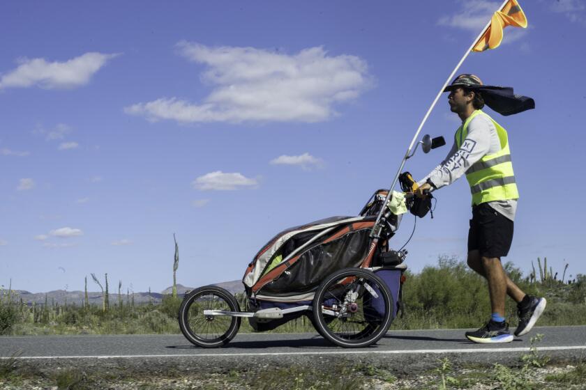 Crucero, Baja California - August 06: Esteban Quinones Gutierrez, 29, continues his months-long journey on Monday, Aug. 6, 2018 outside of Crucero, Baja California. The record distance traveled in a single day was 55 kilometers or just over 34 miles. (Ana Ramirez / The San Diego Union-Tribune)