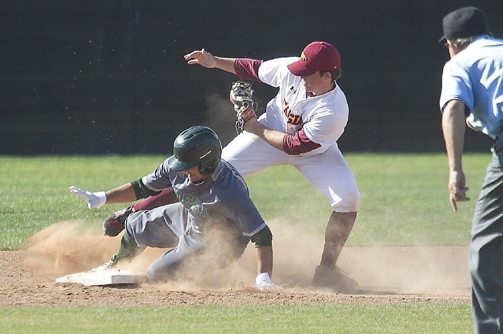 Estancia High's Colin Gardner makes the tag on Costa Mesa's Mark Maes at second base.