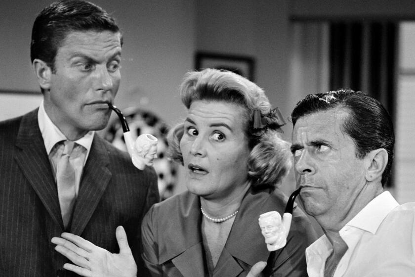 LOS ANGELES - JUNE 19: THE DICK VAN DYKE SHOW episode: "The Meershatz Pipe" featuring (from left) Dick Van Dyke (as Rob Petrie) ; Rose Marie (as Sally Rogers) and Morey Amsterdam (as Buddy Sorrell). Image dated June 19, 1961. (Photo by CBS via Getty Images) ** OUTS - ELSENT, FPG, CM - OUTS * NM, PH, VA if sourced by CT, LA or MoD **