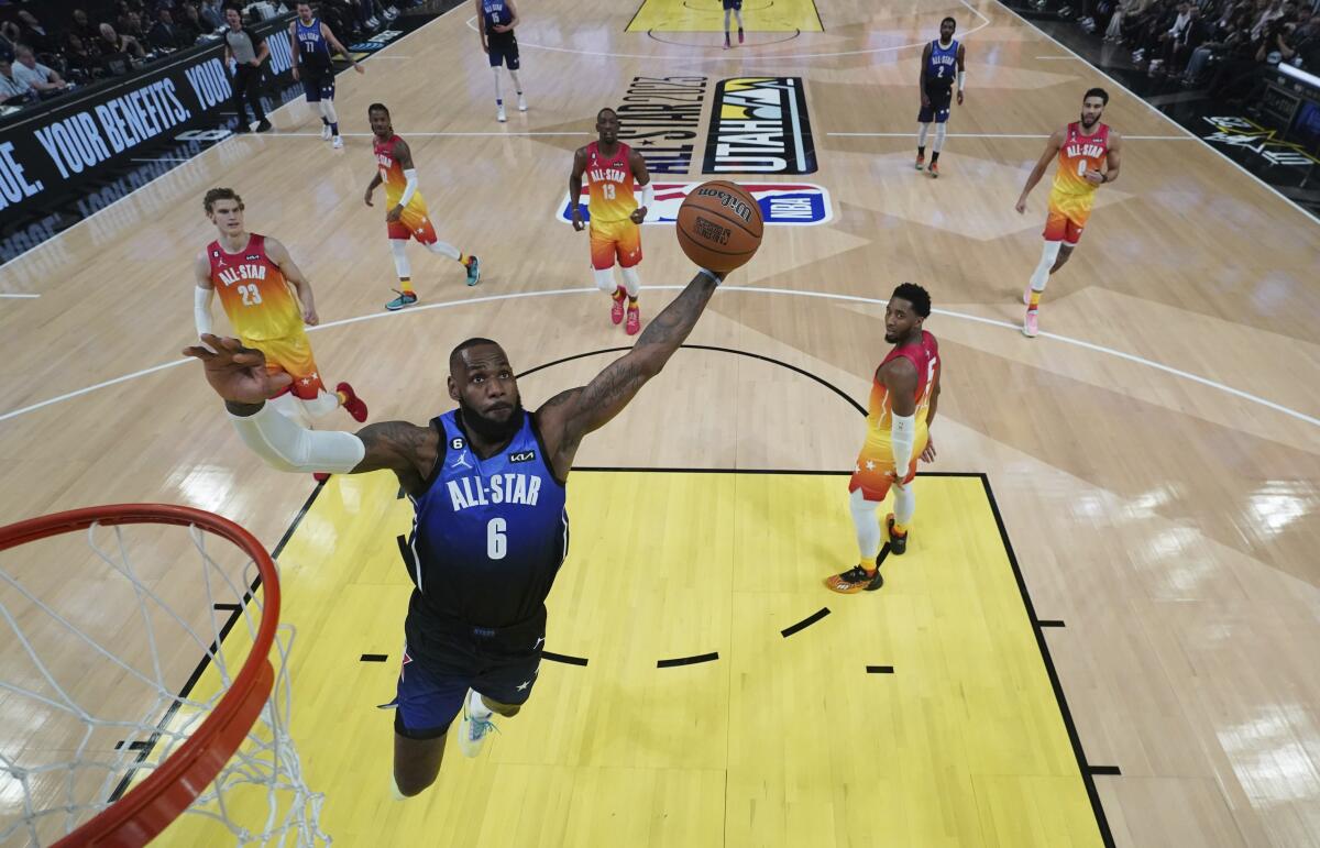 Lakers forward LeBron James soars for a dunk in the 2023 NBA All-Star Game in Salt Lake City.