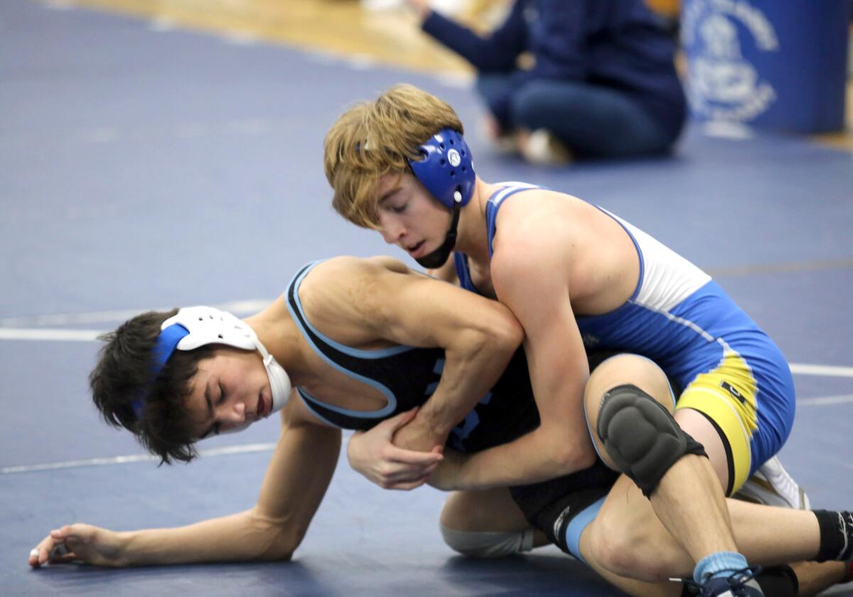 Corona del Mar's Luke Villaluz, left, and Fountain Valley's Kade Ayres compete in a Sunset Conference semifinal in 2019.
