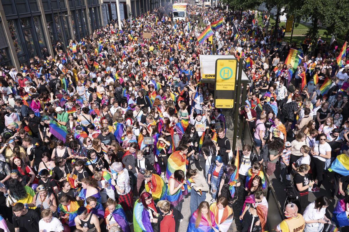 People gather in support of LGBT rights in Dresden, Germany, Saturday, Sept. 4, 2021. (Sebastian Kahnert/dpa via AP)