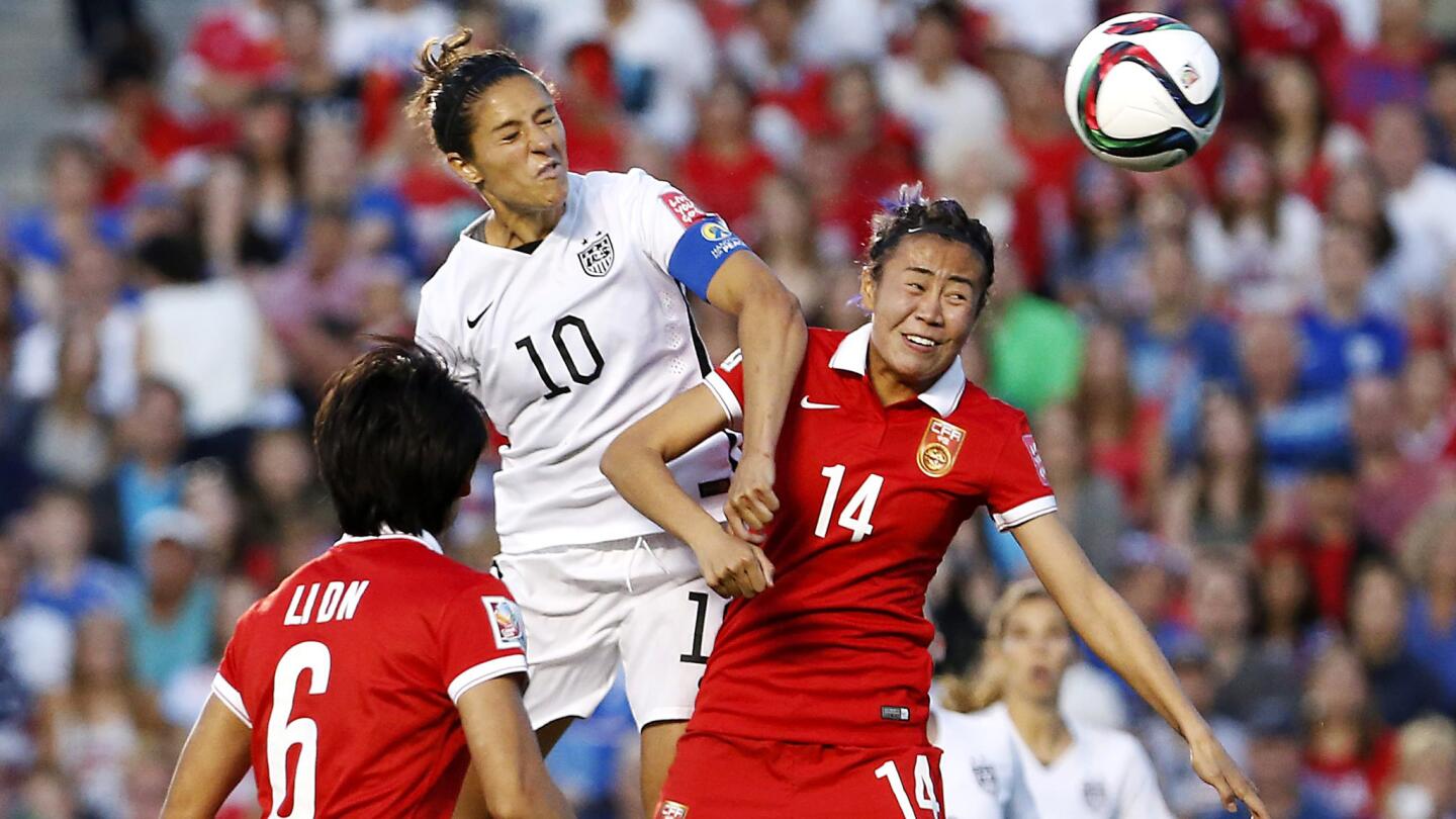 U.S. midfielder Carli Lloyd (10) heads the ball over China's Rong Zhao to score the only goal in a Women's World Cup quarterfinal game on Friday in Ottawa.
