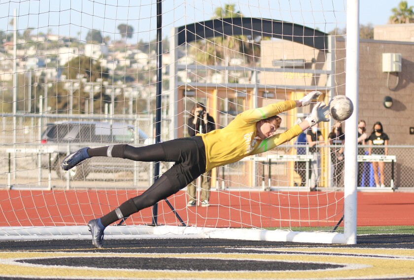 Cathedral Catholic goalkeeper Brady Bachman makes his first PK stop of the game.