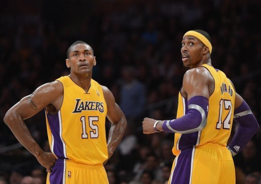 Metta World Peace, left, was an unexpected guest during Lakers teammate Dwight Howard's media session Tuesday morning in Orlando.