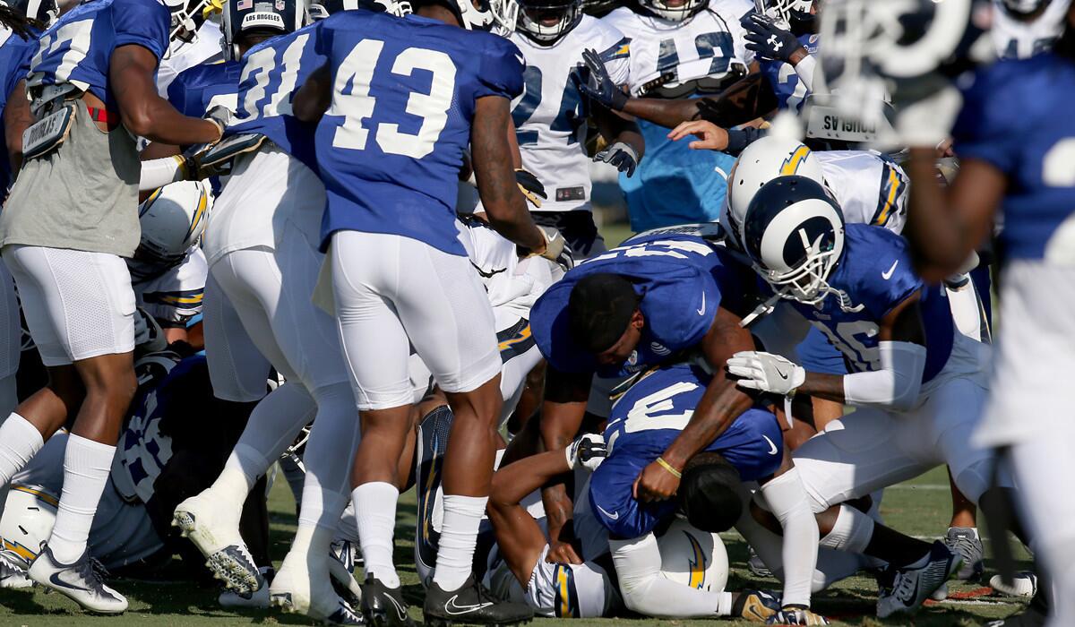 Rams and Chargers players get into a tussle during a joint practice at UC Irvine on Aug. 9.