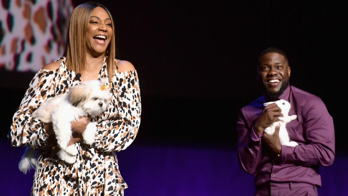 Tiffany Haddish and Kevin Hart with their "The Secret Life of Pets 2" animal counterparts on stage at CinemaCon.