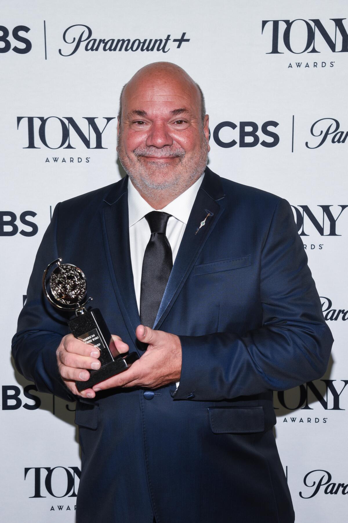 Casey Nicholaw holds his 2023 Tony Award for choreographing "Some Like It Hot."