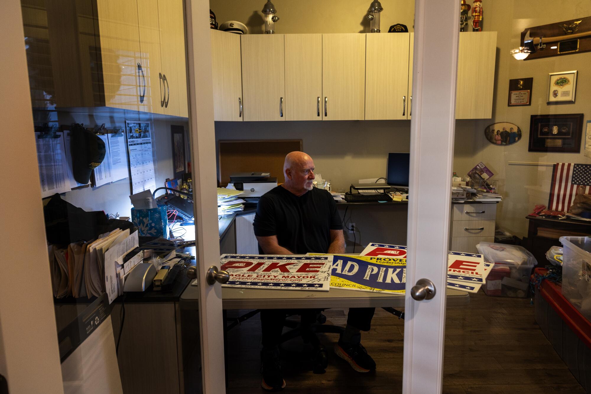 Brad Pike spends time in his home office the day after being elected mayor on Dec. 6 in Eagle, Idaho.