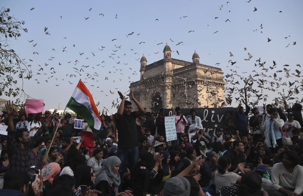 Protesters gathered Monday at Mumbai's Gateway of India, one of several demonstrations held in solidarity with students and teachers who were wounded by masked assailants at New Delhi's Jawaharlal Nehru University.