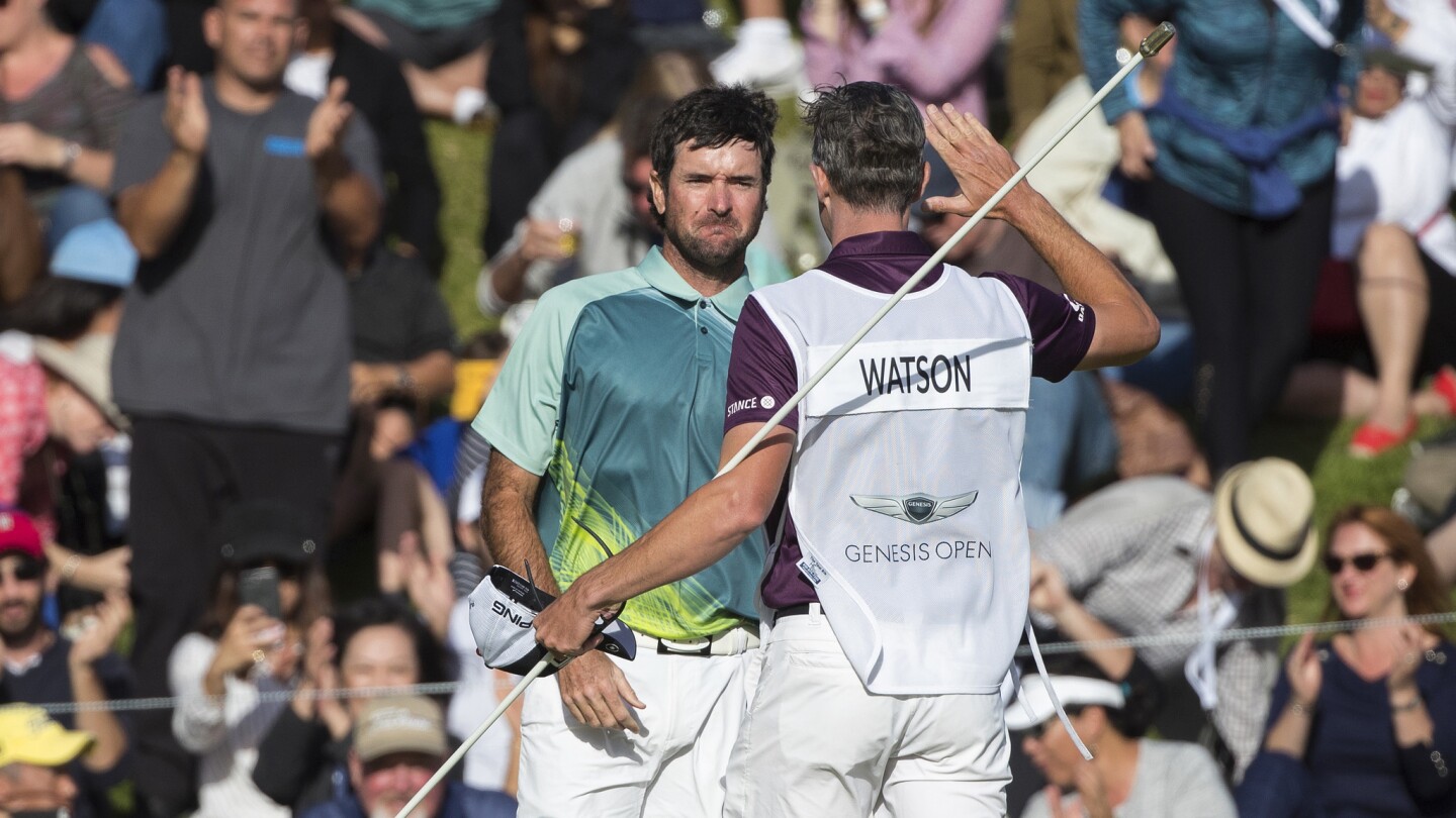 Bubba Watson gets emotional with his caddy after winning the Genesis Open with a 12-under par.