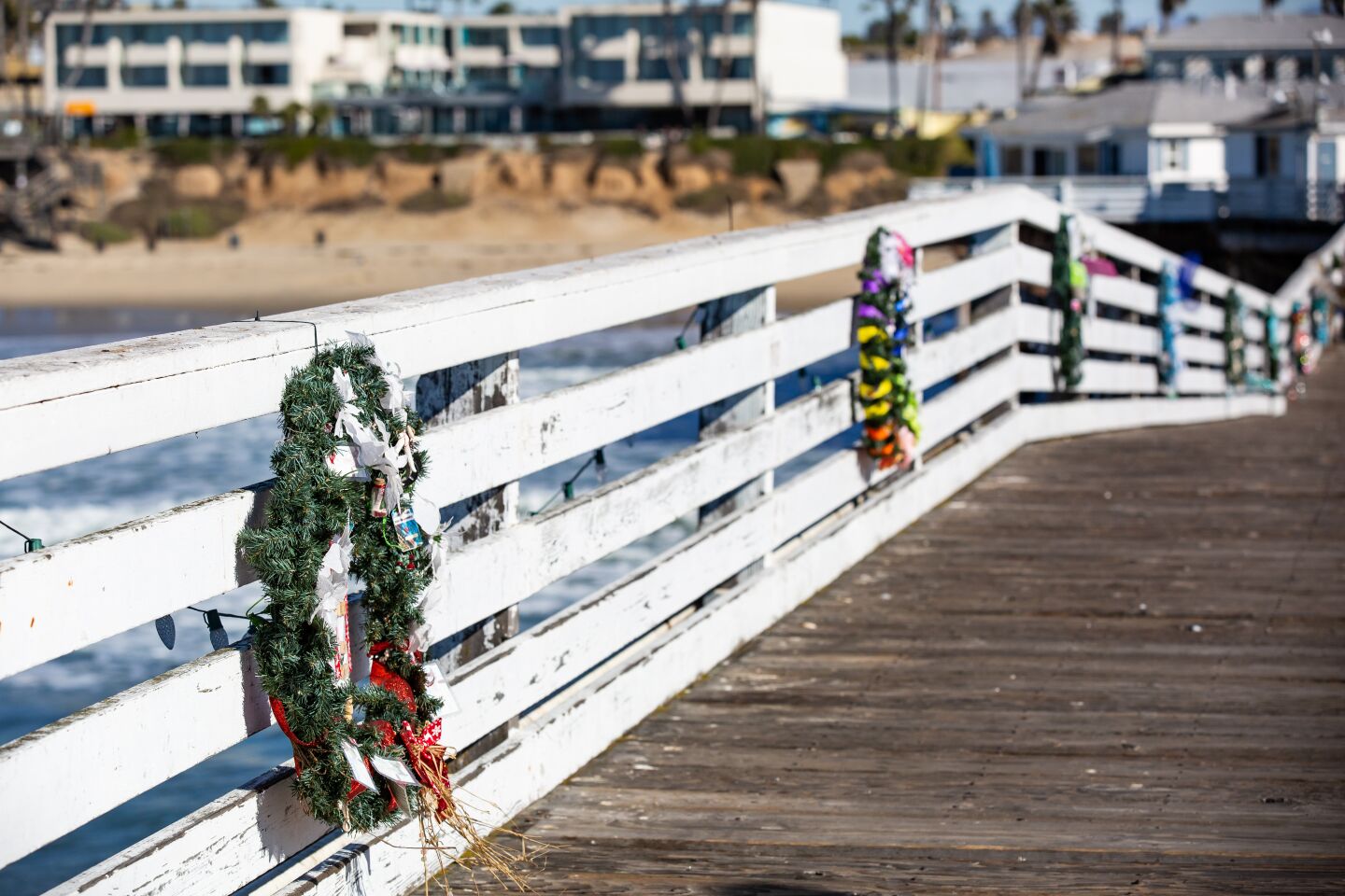 Christmas on Crystal Pier in Pacific Beach featured Christmas lights, wreaths and a large tree at the end of the pier.