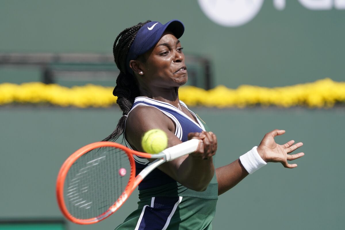 Sloane Stephens, of the United States, returns to Heather Watson, of Britain, at the BNP Paribas Open tennis tournament Wednesday, Oct. 6, 2021, in Indian Wells, Calif. (AP Photo/Mark J. Terrill)