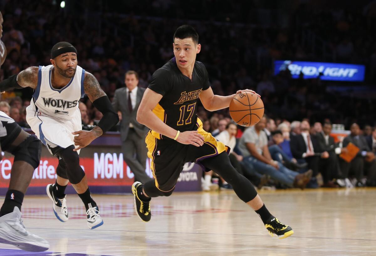 Lakers point guard Jeremy Lin, who finished with 18 points and 11 assists, drives past Timberwolves point guard Mo Williams in the second half.