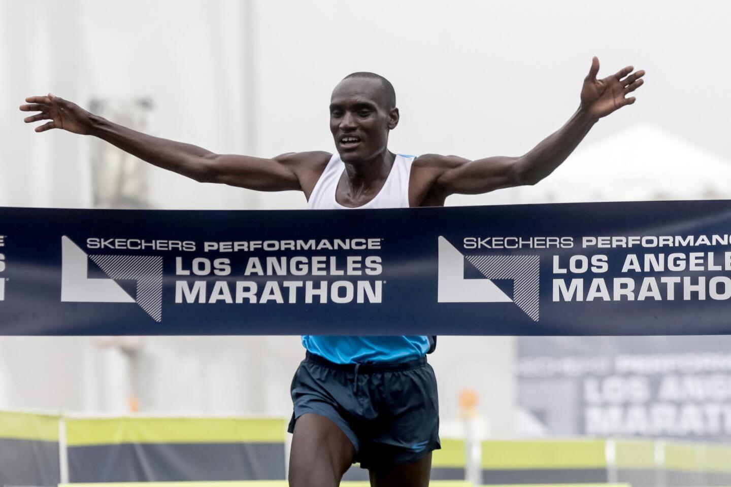 Weldon Kirui of Kenya crosses the finish line to win the L.A. Marathon with an unoffical time of 2:13:05