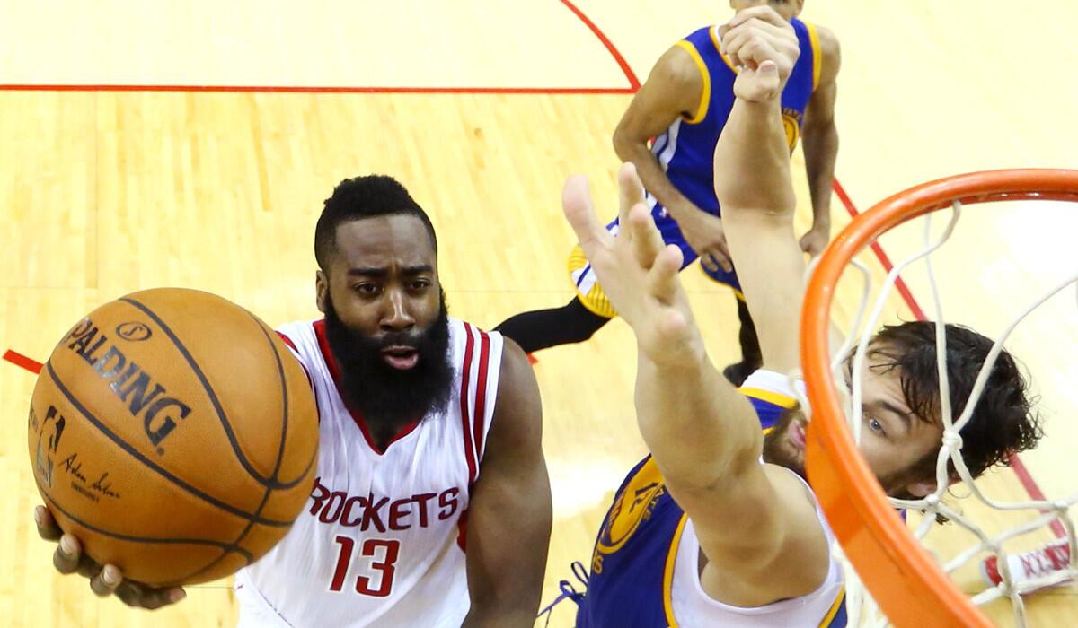 Houston Rockets guard James Harden shoots over Golden State Warriors center Andrew Bogut during the second half of Game 4 of the Western Conference finals on Monday.