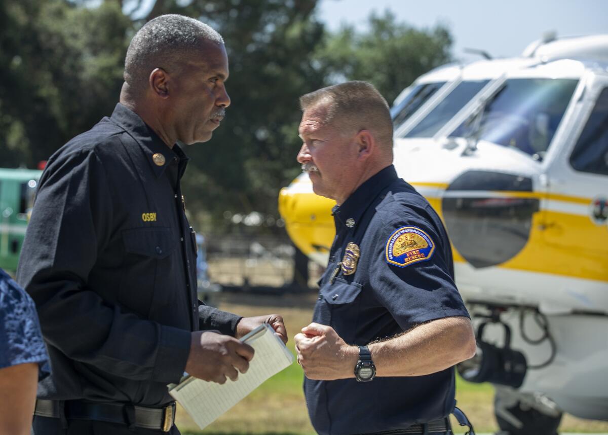 California fire officials Daryl L. Osby, left, and Brian Marshall