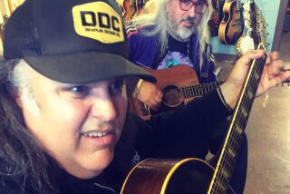 San Diego music artist Otis B, or "O," left, plays guitars with J Macis of the band Dinosaur Jr. O passed away last week.