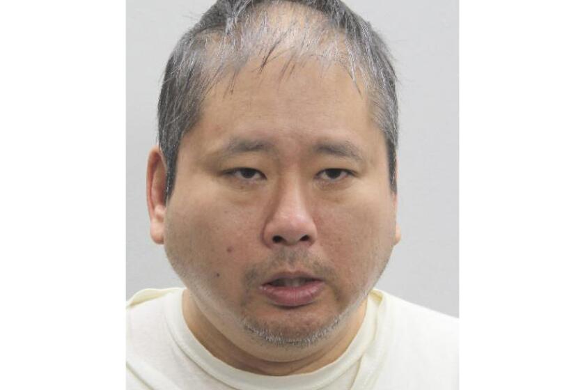 This undated mugshot provided by the Fairfax City Police Department shows Xuan-Kha Tran Pham. On Monday, May 15, 2023, a man with a metal baseball bat walked into the northern Virginia office of U.S. Rep. Gerry Connolly, asked for him, and struck two of his workers with the bat, police and the congressman said. The U.S. Capitol Police and Fairfax City Police identified the suspect as Xuan-Kha Tran Pham, 49, of Fairfax. (Fairfax City Police Department via AP)