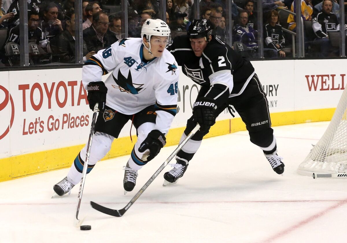 San Jose's Tomas Hertl controls the puck in front of the Kings' Matt Greene at Staples Center on Oct. 30. Greene was to be placed on long-term injured reserve with an upper-body injury.