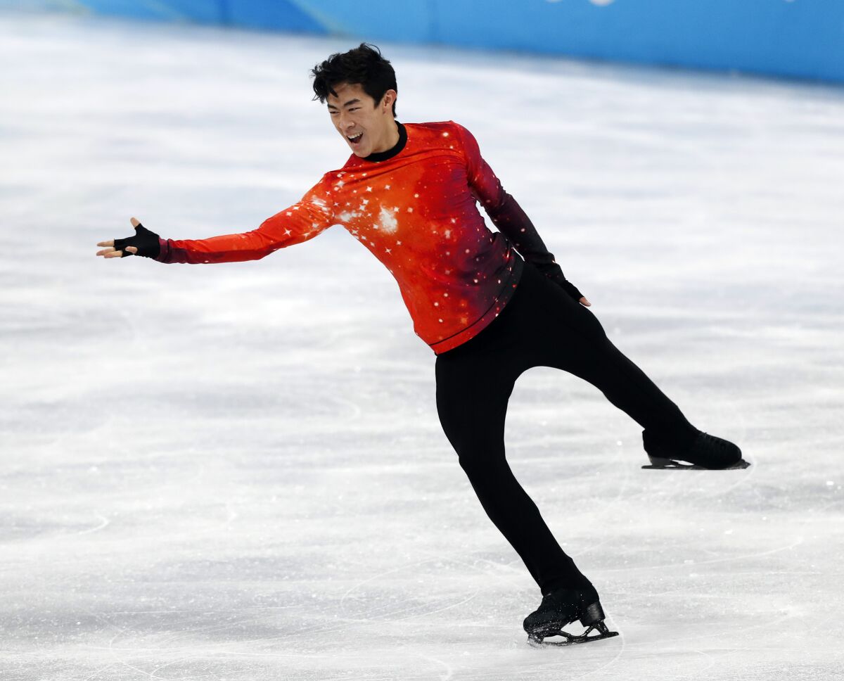 Nathan Chen performs during his free skate program on his way to winning individual gold at the Beijing Olympics.