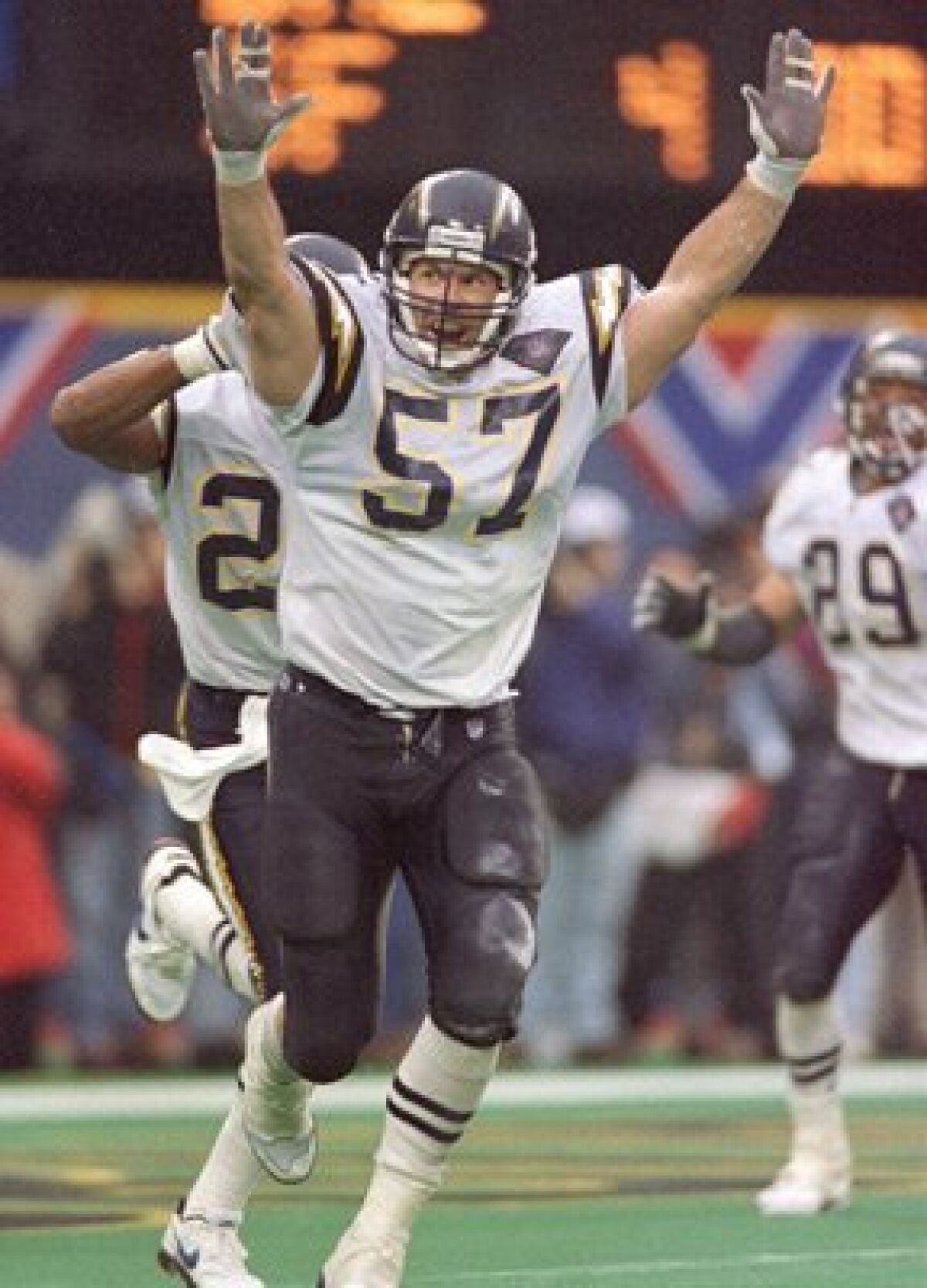 Chargers' Dennis Gibson celebrates after making winning defensive play at the 1995 AFC Championship Game.