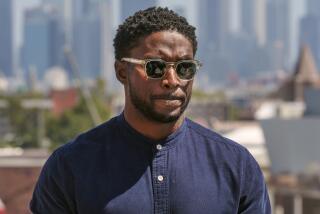 Former USC football player Reggie Bush listens to questions during a news conference at the Coliseum 