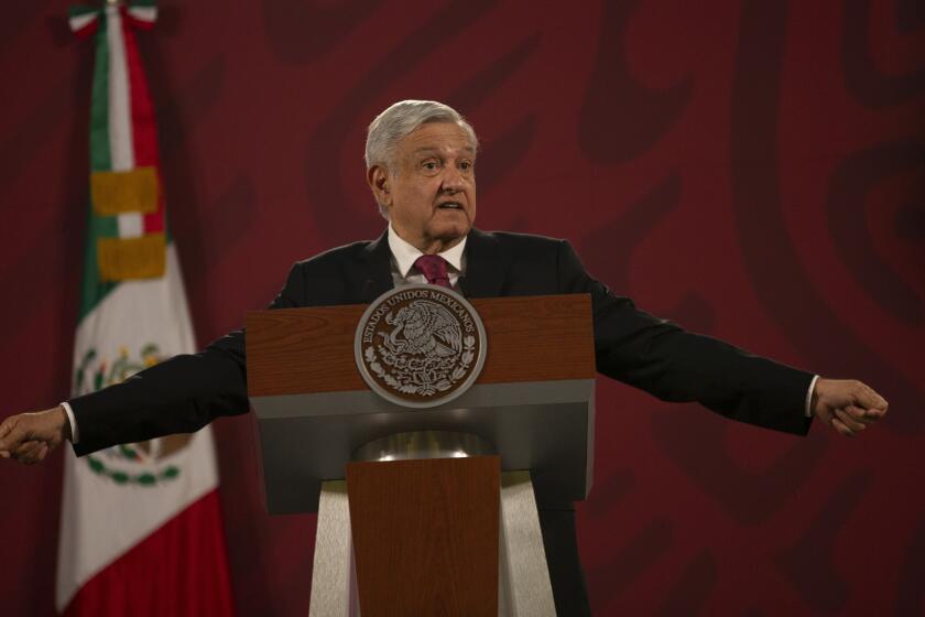 Mexico's President Andres Manuel Lopez Obrador gives his daily, morning news conference at the presidential palace, Palacio Nacional, in Mexico City, Monday, July 13, 2020. (AP Photo/Marco Ugarte)