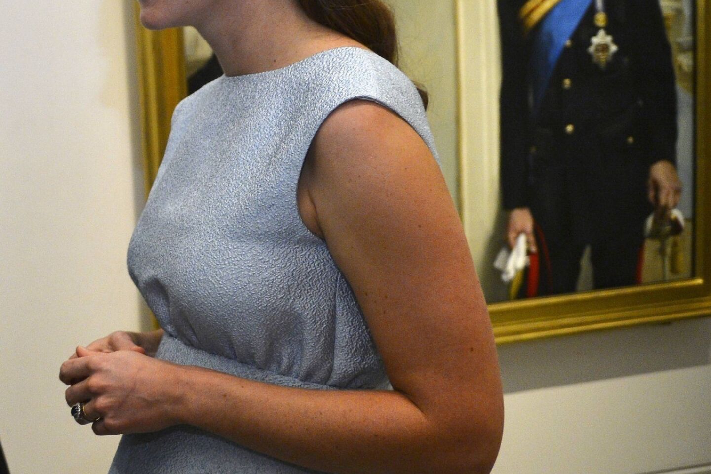 The duchess walks past a painting of Prince William at the National Portrait Gallery in London. The Art Room, for which she is a patron, is a charity offering art as therapy to increase children's self-confidence and independence.