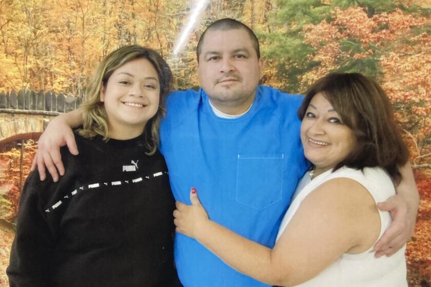 Sept. 2023 image of Lombardo Palacios, center, with his sister, Sigry Ortez, left, and his mother. Palacios was 15 when he falsely confessed to murder after hours of relentless police interrogation.