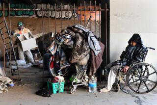 Inglewood, California January 25, 2022: A homeless that goes by the name "Richard" is kicked out of a homeless encampment under the 405 freeway in Inglewood Tuesday morning as work crews clean-up personal belongings and trash in preparation for the Super Bowl. (Wally Skalij/Los Angeles Times)