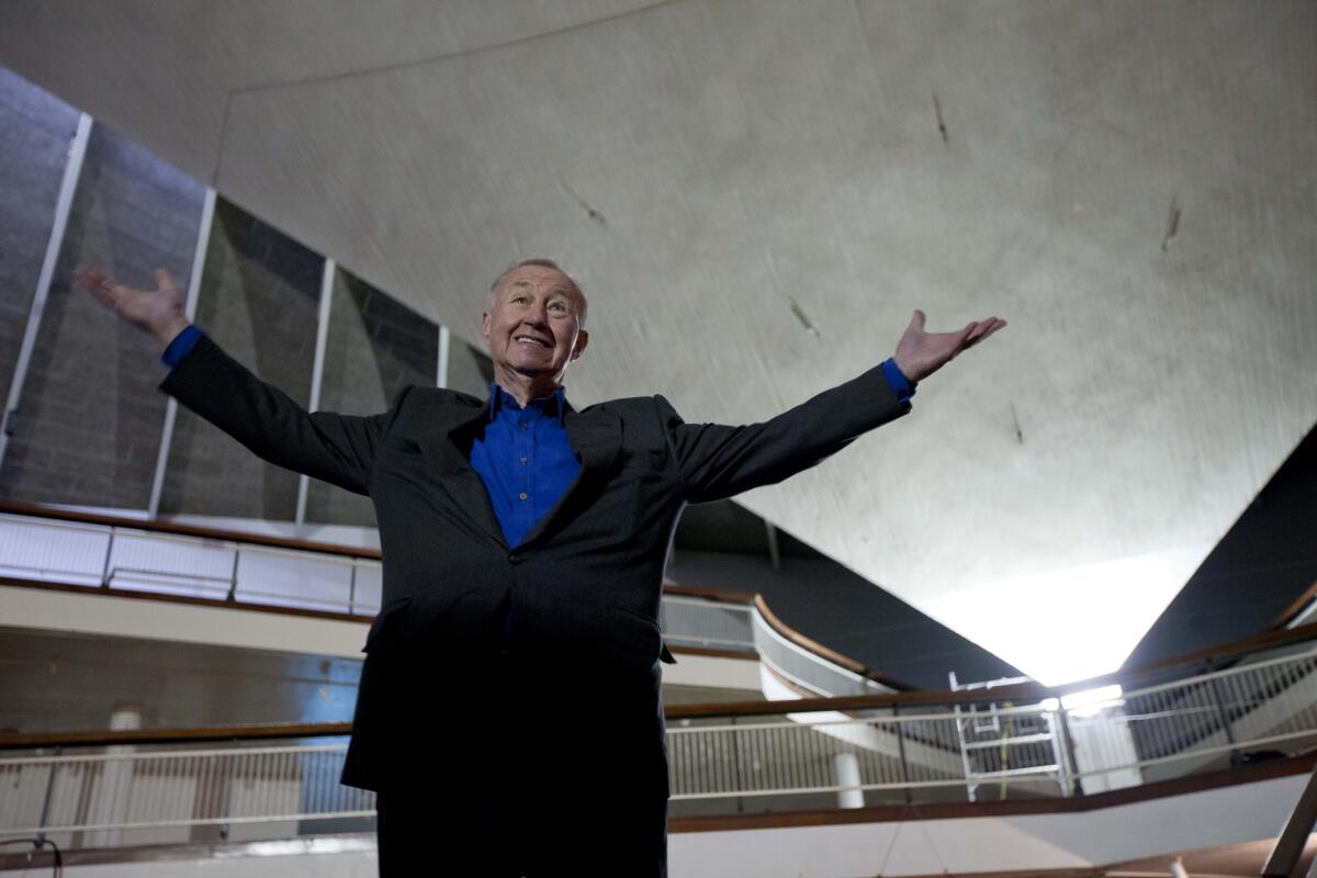 Terence Conran poses for photographs with his arms extended at an event for the British Design Museum.