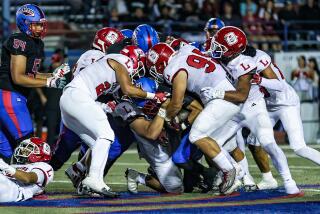 Orange Lutheran defense gets physical against Gardena Serra.