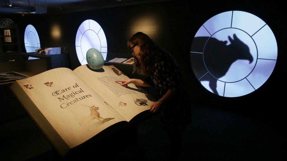 A staff member checks out the "Harry Potter: A History of Magic" exhibition at the British Library in London.