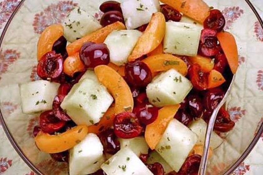 FRESHEN UP: Basil and a hint of white wine jazz up a cherry, apricot and honeydew salad.