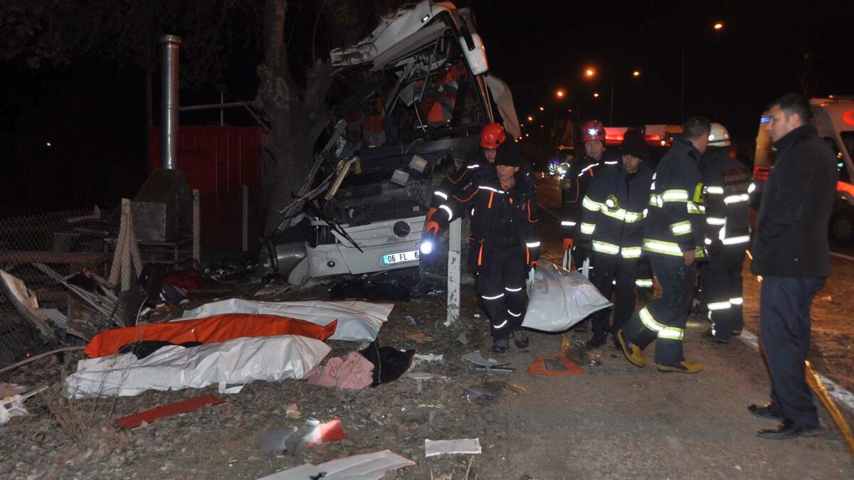 Crews work the scene after a bus crashed into trees in Eskisehir province, Turkey.