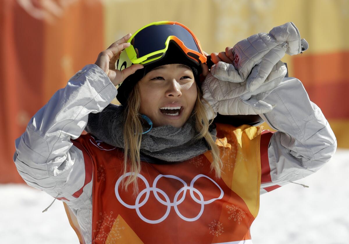 Chloe Kim smiles during the women's halfpipe finals during the 2018 Winter Olympics in Pyeongchang, South Korea.