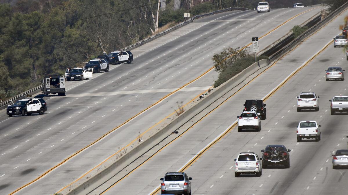 The eastbound 134 Freeway is closed as the LAPD conducts an investigation into the shooting of an LAPD vehicle on the freeway early Sunday morning.