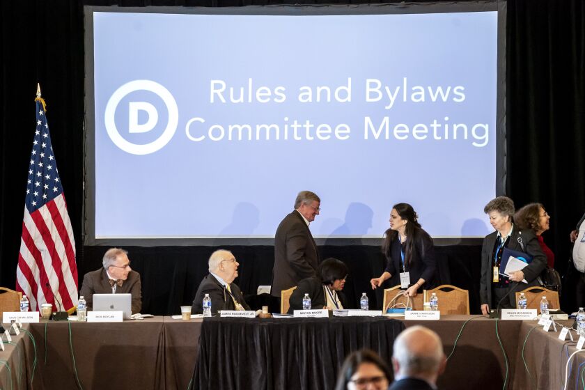The Democratic National Committee Rules and Bylaws Committee discuss proposed changes to the primary system during a meeting at the Omni Shoreham Hotel on Friday, Dec. 2, 2022, in Washington. (AP Photo/Nathan Howard)
