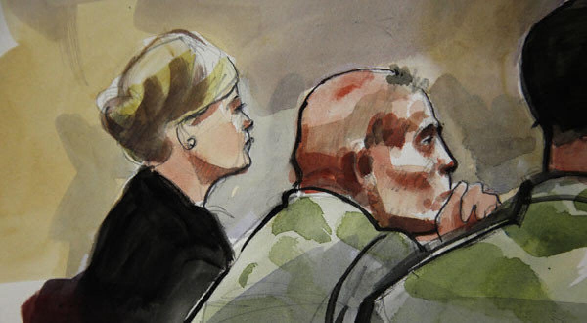 In this detail of a courtroom sketch, U.S. Army Staff Sgt. Robert Bales, center, is shown with attorney Emma Scanla during a preliminary hearing.