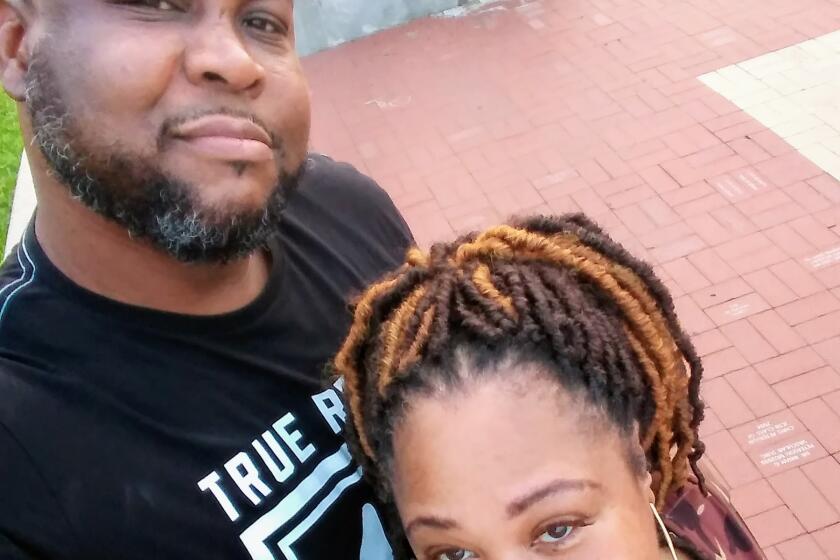 Mitchell and Crystal Hughes in summer of 2019 on the campus of St. Louis University.