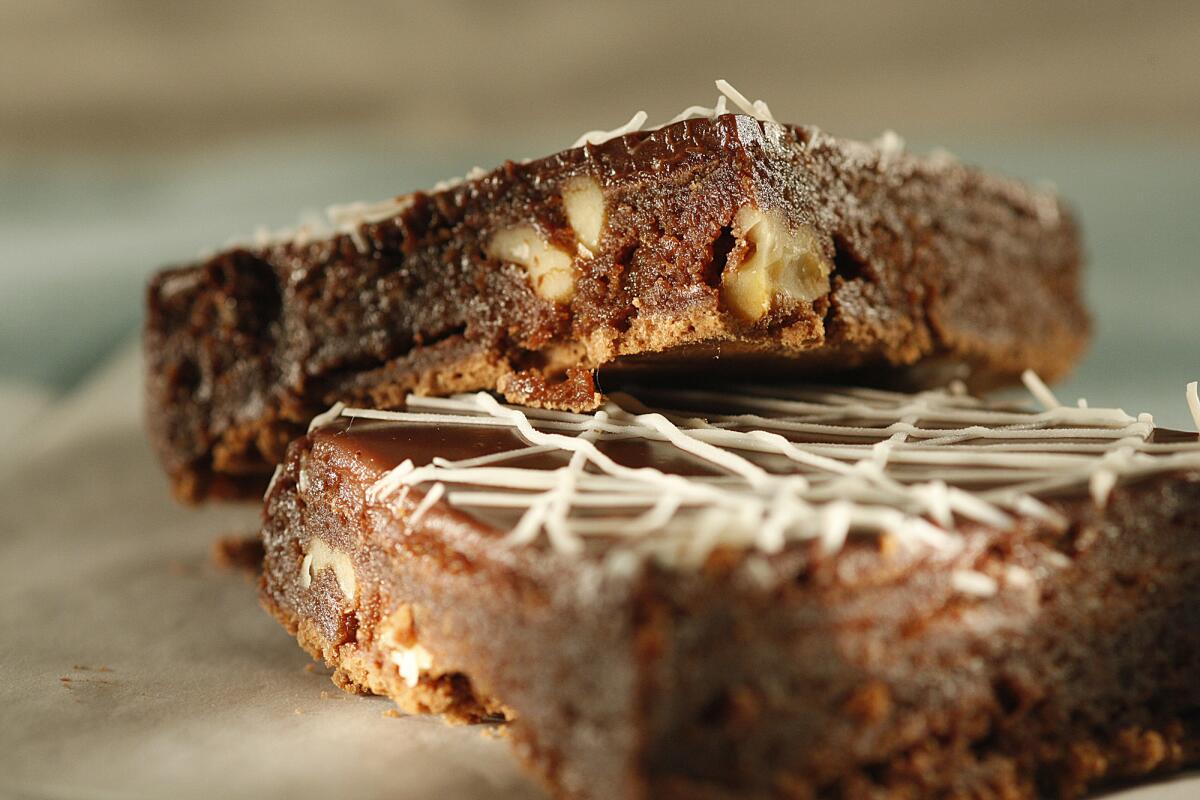 A delicate, crisp crust enveloping a wonderfully ooey-gooey filling. Recipe: Lucca Cafe's brownies