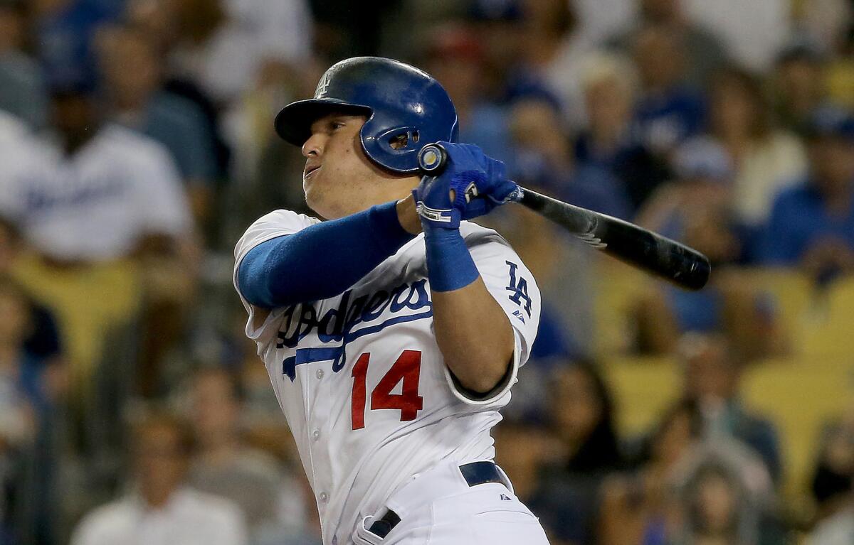Dodgers pinch-hitter Enrique Hernandez hits a two-run double against the Oakland Athletics in the seventh inning on Wednesday.