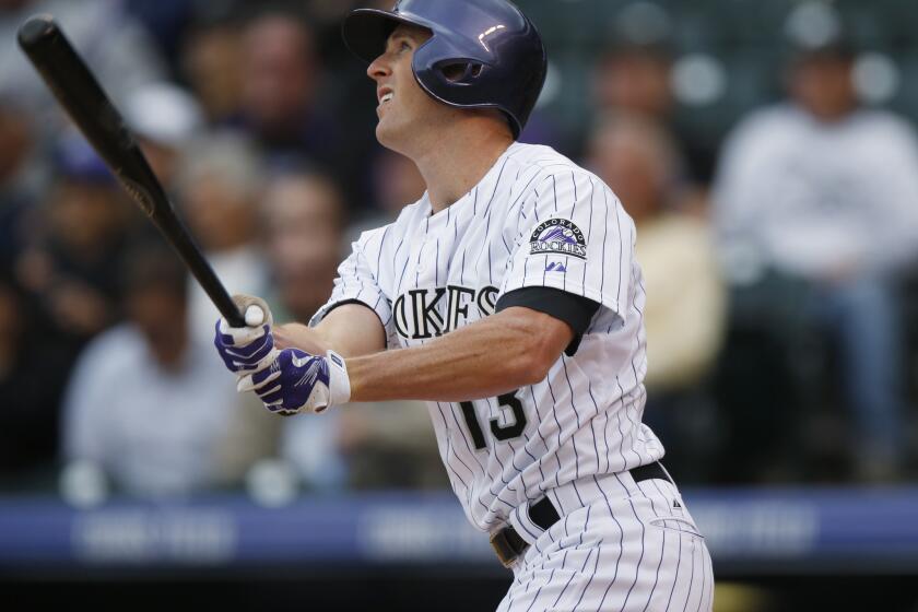 Colorado Rockies pinch-hitter Drew Stubbs watches the flight of a two-run home run during a game against the Arizona Diamondbacks on May 6.
