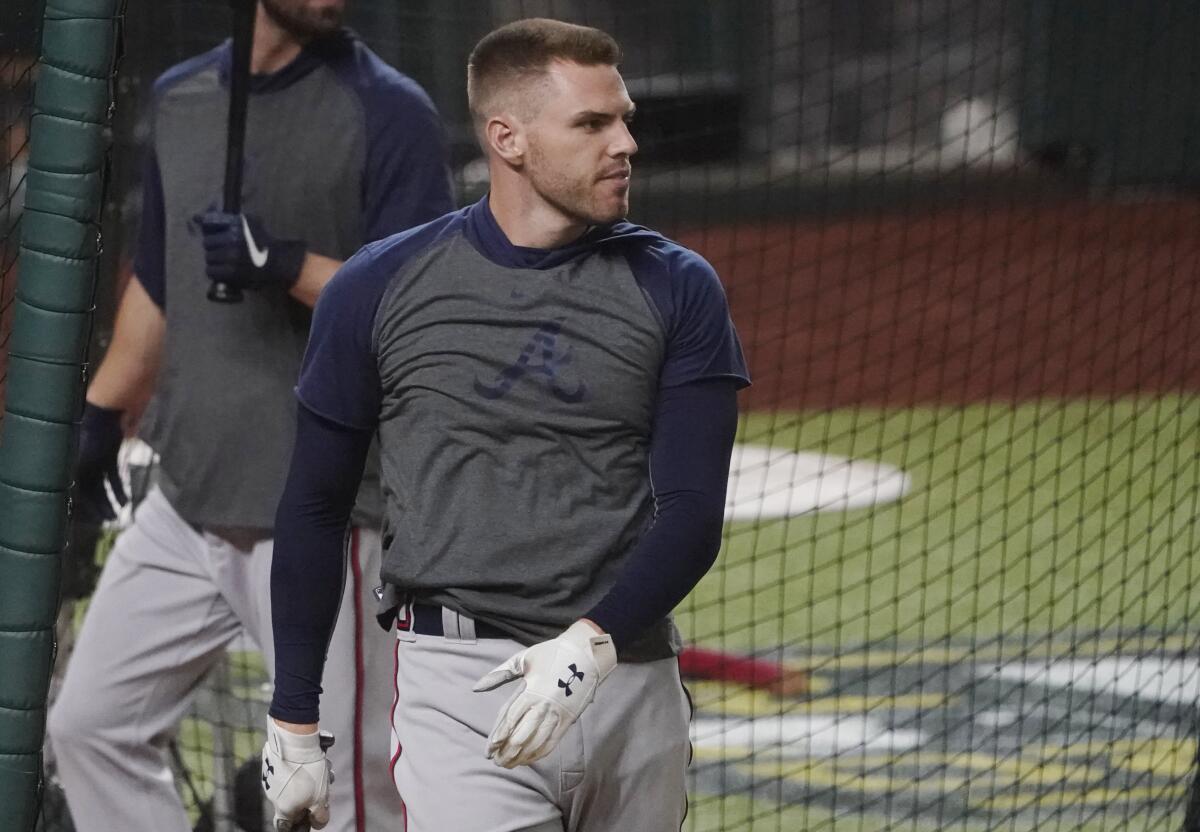 Atlanta Braves' Freddie Freeman walks out of the batting cage.