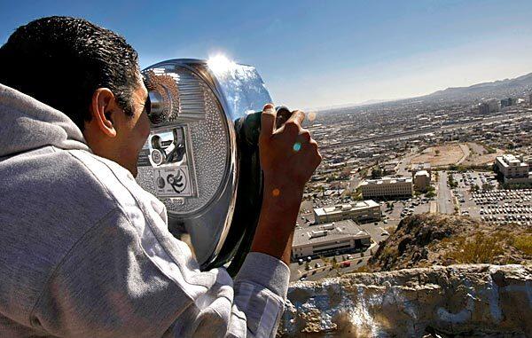 From a viewpoint in El Paso, Ricardo Chavez Aldana looks at his former home across the border in Ciudad Juarez. He was once a radio investigative reporter for Radio Canon in Ciudad Juarez. After gunmen killed his young nephew he fled to El Paso and is unemployed.