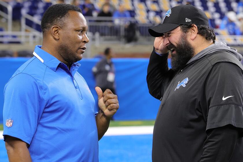 DETROIT, MI - NOVEMBER 28: Former Detroit Lions Barry Sanders talks with Head Coach Matt Patricia prior to the start of the game against the Chicago Bears at Ford Field on November 28, 2019 in Detroit, Michigan. (Photo by Leon Halip/Getty Images)