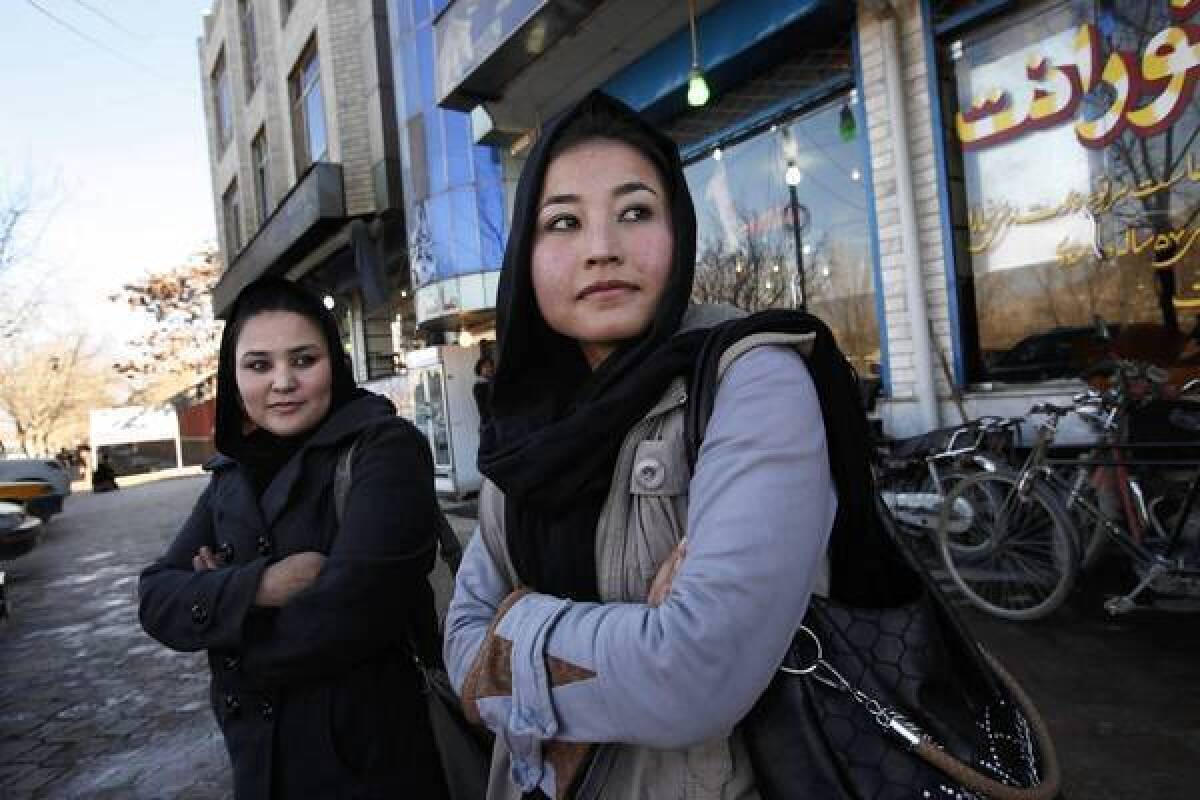 In Kabul, 2nd Lt. Sourya Saleh, 20, left, and 2nd Lt. Masooma Hussaini are Afghan air force helicopter pilots who were trained in the United States.