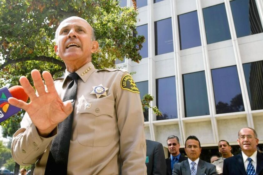 Los Angeles County Sheriff Lee Baca addresses the media outside department headquarters after the ACLU of Southern California called for his resignation over alleged abuse of inmates.